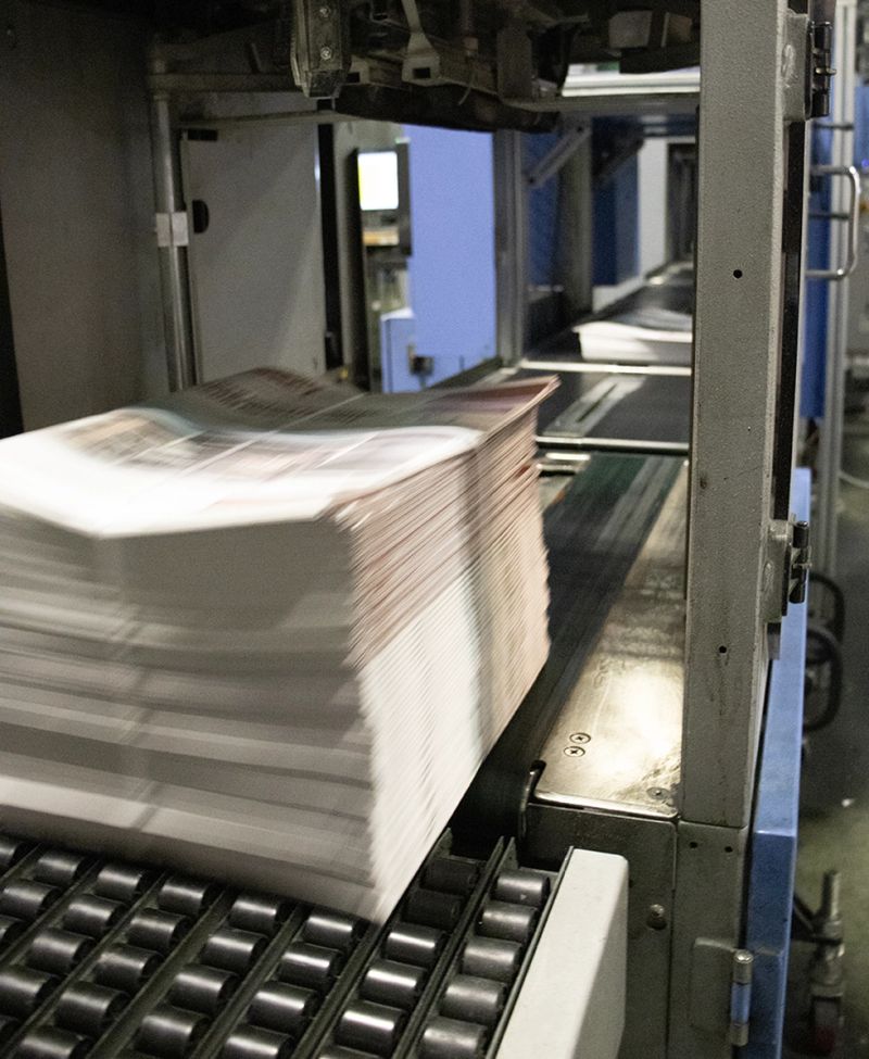 Commercial printing press producing marketing materials for Austin businesses